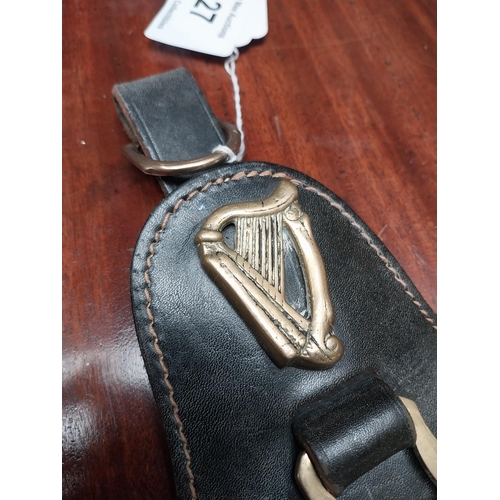 127 - Guinness Year 1980 badge and leather strap. {23 cm H x 12 cm W}