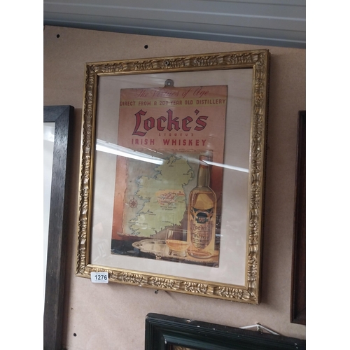 1276 - Locke's Irish Whiskey framed showcard. {45 cm H x 37 cm W}.