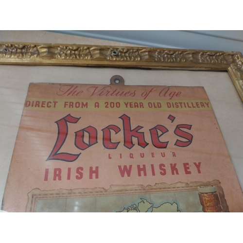 1276 - Locke's Irish Whiskey framed showcard. {45 cm H x 37 cm W}.