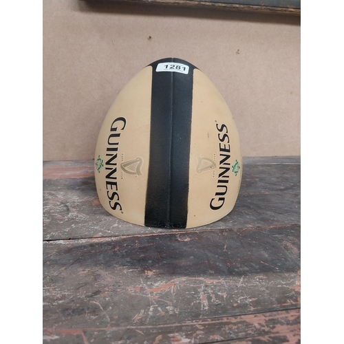 1281 - Guinness Rugby Ball counter advertising model. {21 cm H x 19 cm Diam.}.