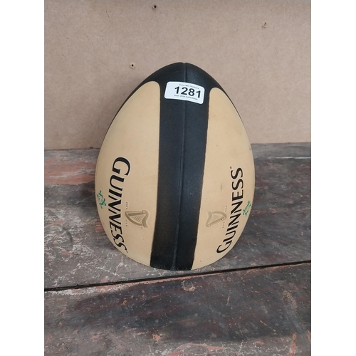 1281 - Guinness Rugby Ball counter advertising model. {21 cm H x 19 cm Diam.}.