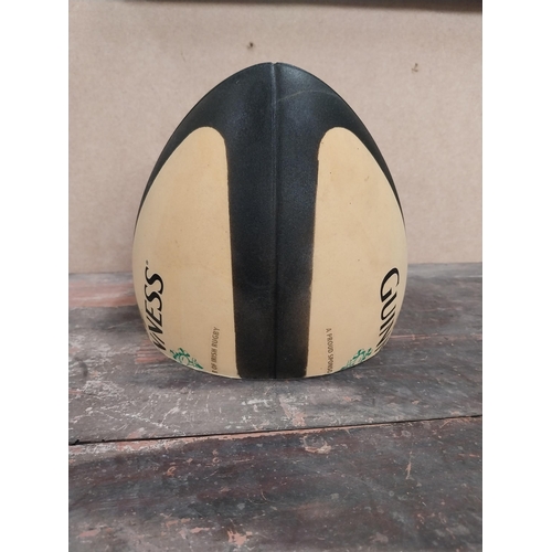 1281 - Guinness Rugby Ball counter advertising model. {21 cm H x 19 cm Diam.}.