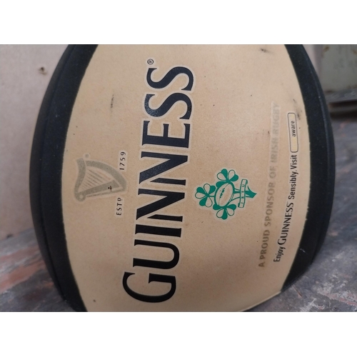 1281 - Guinness Rugby Ball counter advertising model. {21 cm H x 19 cm Diam.}.