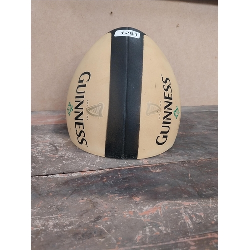 1281 - Guinness Rugby Ball counter advertising model. {21 cm H x 19 cm Diam.}.