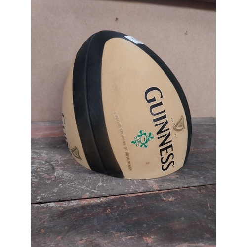 1281 - Guinness Rugby Ball counter advertising model. {21 cm H x 19 cm Diam.}.