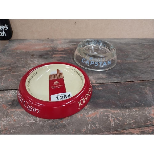 1284 - Glass Wills's Capstan ashtray {4 cm H x 12 cm Dia.} and Player's Mild Cigars ashtray {3 cm H x 15 cm... 