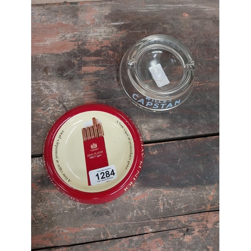 1284 - Glass Wills's Capstan ashtray {4 cm H x 12 cm Dia.} and Player's Mild Cigars ashtray {3 cm H x 15 cm... 