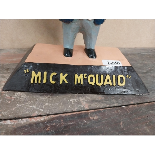 1288 - Mick McQuaid composition advertising figure. {36 cm H x 28 cm W x 17 cm D}.