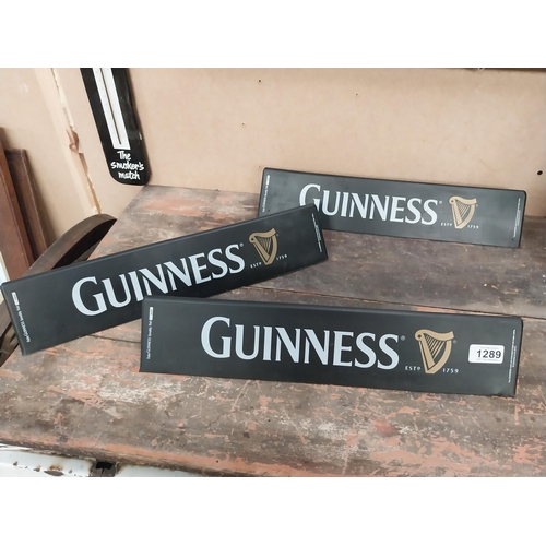 1289 - Three Guinness counter signs. {9 cm H x 45 cm W}.