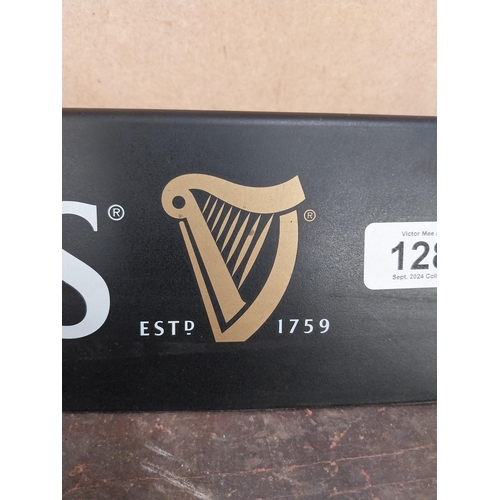 1289 - Three Guinness counter signs. {9 cm H x 45 cm W}.