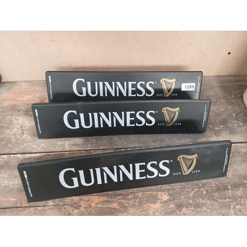 1289 - Three Guinness counter signs. {9 cm H x 45 cm W}.