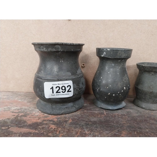 1292 - Seven early 19th C. pewter whiskey measures. {10 cm H x 8 cm Diam to 5 cm W x 4 cm Diam.}.