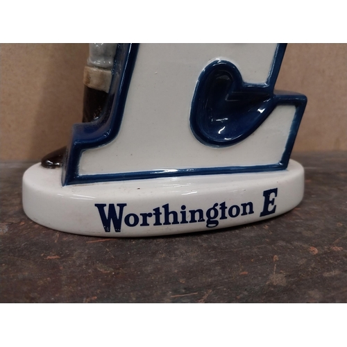 1294 - Worthington's Ale E ceramic Beswick advertising figural group. {24 cm H x 15 cm W x 5 cm D}.