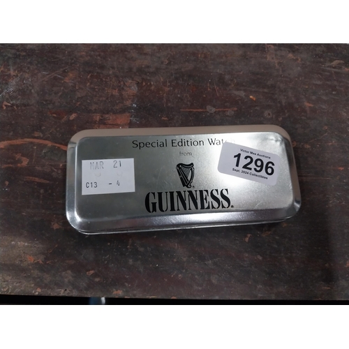 1296 - Guinness advertising watch in tin presentation case.