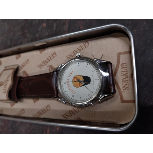 1296 - Guinness advertising watch in tin presentation case.