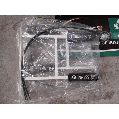 1297 - Box of Guinness memorabilia - showcards, banners etc and optic in box.