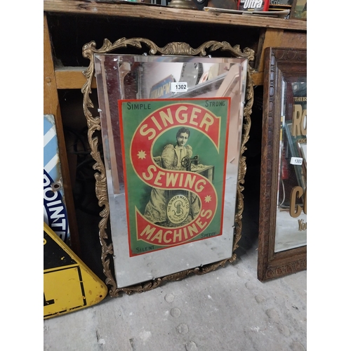 1302 - Singer Sewing Machines advertising mirror in gilt frame. {64 cm H x 45 cm W}.