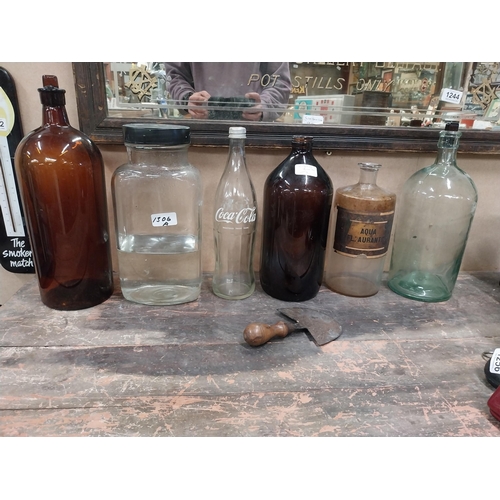 1306A - Miscellaneous lot of glass sweet jars, four chemist bottles, Coca Cola bottle and tobacco cutter. {2... 