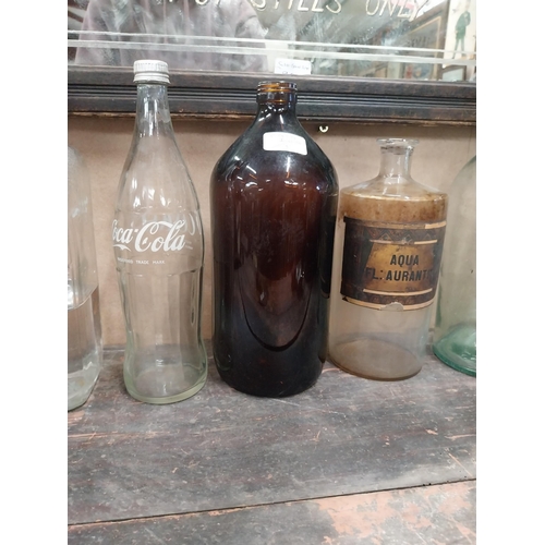 1306A - Miscellaneous lot of glass sweet jars, four chemist bottles, Coca Cola bottle and tobacco cutter. {2... 