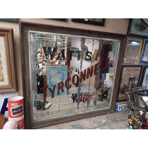 1308 - Early 1900's Watt's Tyrconnell Whisky mirror in original decorated frame. {125 cm H x 138 cm W}.