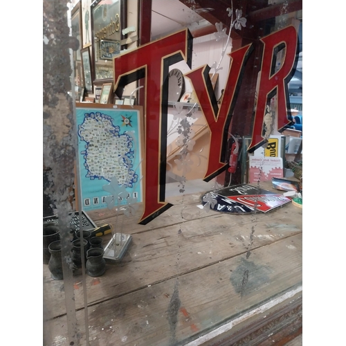 1308 - Early 1900's Watt's Tyrconnell Whisky mirror in original decorated frame. {125 cm H x 138 cm W}.