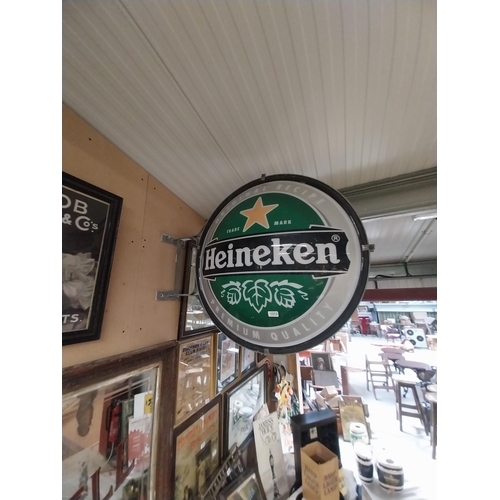 1313 - Heineken Lager double sided light up advertising sign with wall bracket. {79 cm H x 99 cm W}.