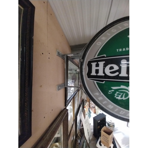 1313 - Heineken Lager double sided light up advertising sign with wall bracket. {79 cm H x 99 cm W}.