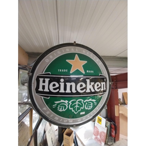 1313 - Heineken Lager double sided light up advertising sign with wall bracket. {79 cm H x 99 cm W}.