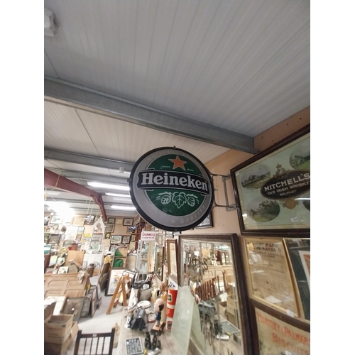 1313 - Heineken Lager double sided light up advertising sign with wall bracket. {79 cm H x 99 cm W}.