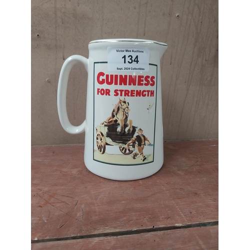 134 - Guinness for Strength ceramic water advertising jug. {22 cm H x 19 cm W x 16 cm D}.