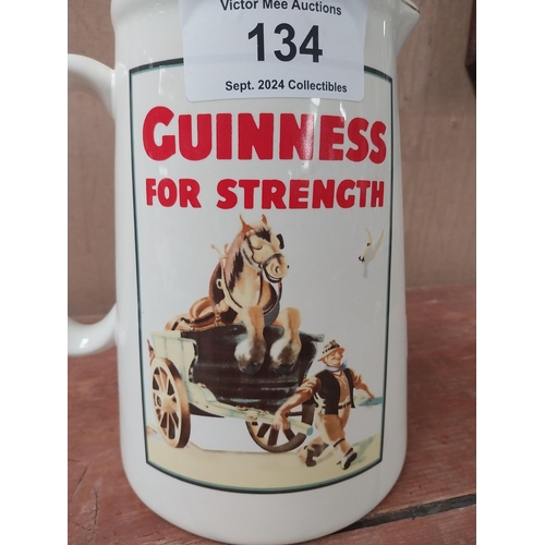 134 - Guinness for Strength ceramic water advertising jug. {22 cm H x 19 cm W x 16 cm D}.