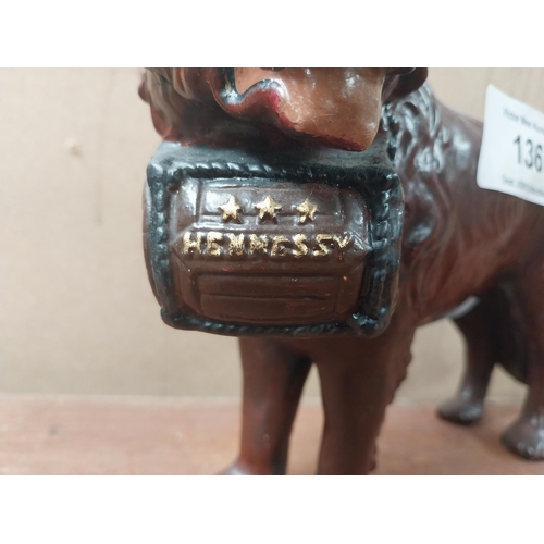 136 - Hennessey Cognac composition advertising Dog figure. {25 cm H x 20 cm W x 9 cm D}.