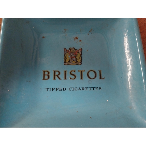 14 - Two enamel ashtrays  - Bristol Cigarettes and Woodbine Cigarettes. {13 cm H x 13 cm W}