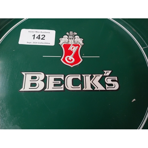 142 - Beck's Lager {33 cm Diam.} and Truman's Beer and Ale  {32 cm H x 41 cm W} tin plate advertising tray... 