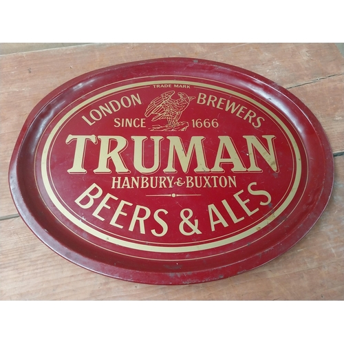 142 - Beck's Lager {33 cm Diam.} and Truman's Beer and Ale  {32 cm H x 41 cm W} tin plate advertising tray... 