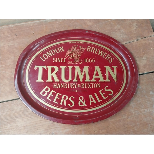 142 - Beck's Lager {33 cm Diam.} and Truman's Beer and Ale  {32 cm H x 41 cm W} tin plate advertising tray... 