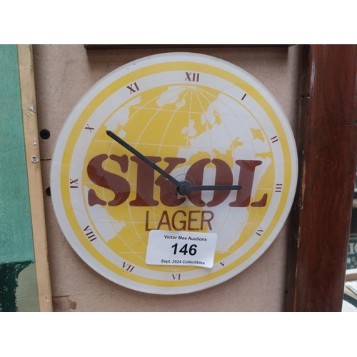 146 - SKOL Perspex advertising battery clock. {20 cm H x 22 cm W}.