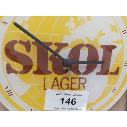 146 - SKOL Perspex advertising battery clock. {20 cm H x 22 cm W}.