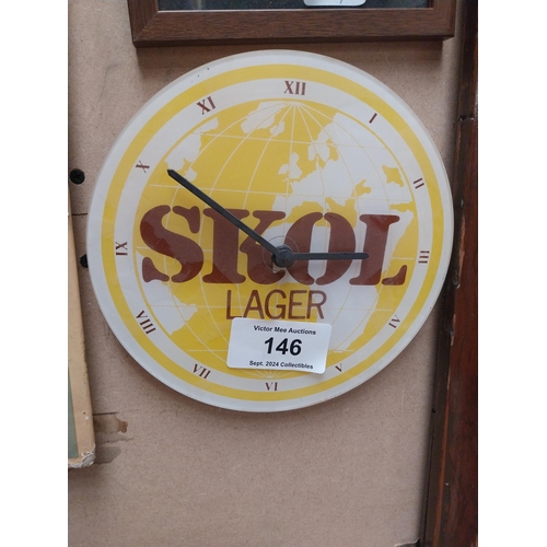 146 - SKOL Perspex advertising battery clock. {20 cm H x 22 cm W}.