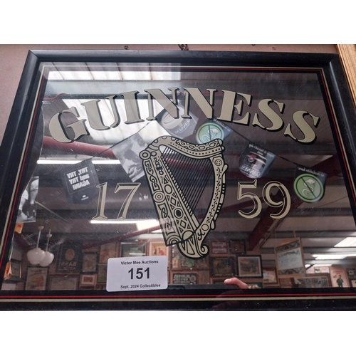 151 - Guinness advertising mirror in wooden frame. {37 cm H x 47 cm W}.