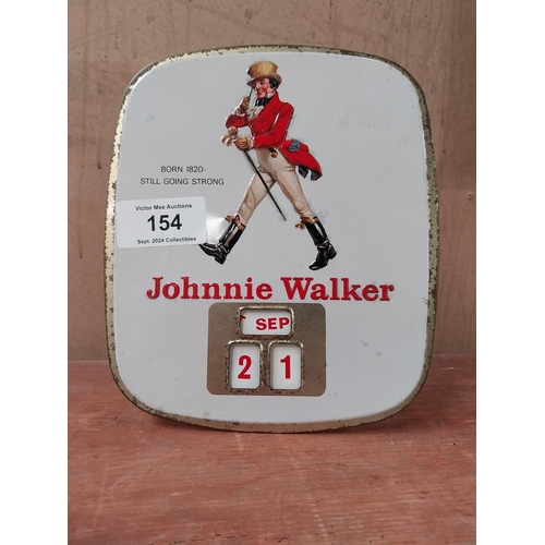 154 - Johnnie Walker Born 1820 - Still Going Strong tin plate advertising calender. {27cm H X 24cm W}.