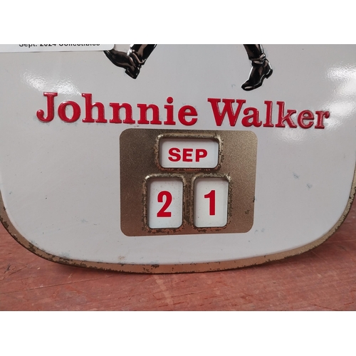 154 - Johnnie Walker Born 1820 - Still Going Strong tin plate advertising calender. {27cm H X 24cm W}.