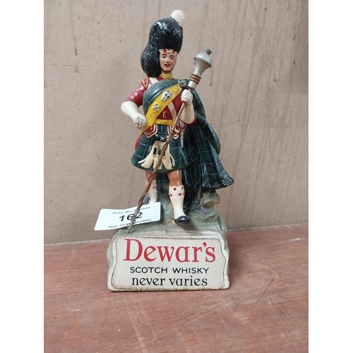 162 - Dewar's Scotch Whiskey Ruberoid advertising figure. {24 cm H x 11 cm W x 8 cm D}.