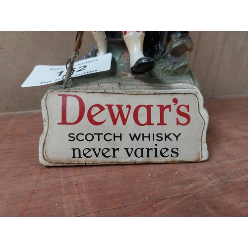 162 - Dewar's Scotch Whiskey Ruberoid advertising figure. {24 cm H x 11 cm W x 8 cm D}.