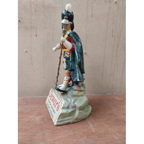 162 - Dewar's Scotch Whiskey Ruberoid advertising figure. {24 cm H x 11 cm W x 8 cm D}.