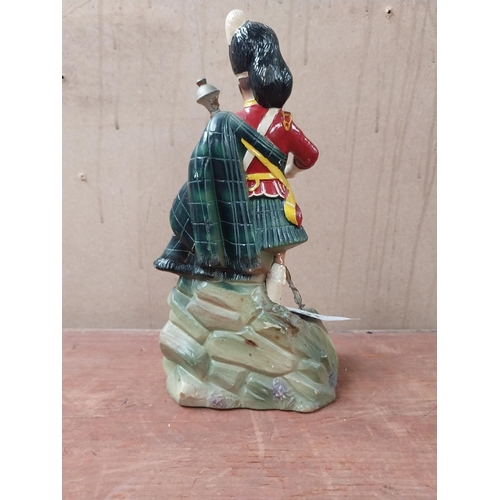 162 - Dewar's Scotch Whiskey Ruberoid advertising figure. {24 cm H x 11 cm W x 8 cm D}.