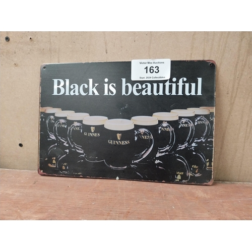 163 - Black is Beautiful Guinness tin plate advertising sign. {20 cm H x 30 cm W}.