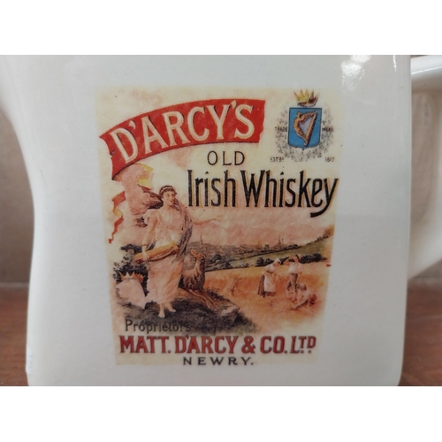 172 - Old Bushmills Whiskey ceramic water jug. {18 cm H x 15 cm W x 10 cm D} and D'Arcy's Old Irish Whiske... 