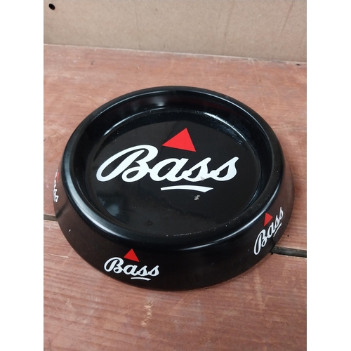 173 - Two Bass tin plate advertising ashtrays. {4 cm H x 20 cm Diam.}