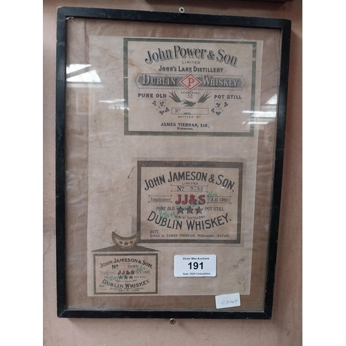 191 - Framed collection of three John Jameson and John Powers Whiskey labels. {44 cm H x 35 cm W}.